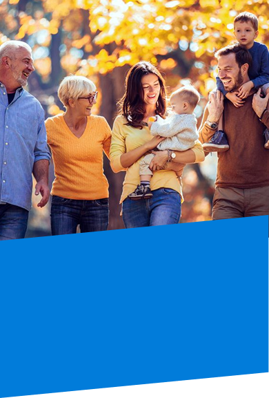 immediate family walking through the trees